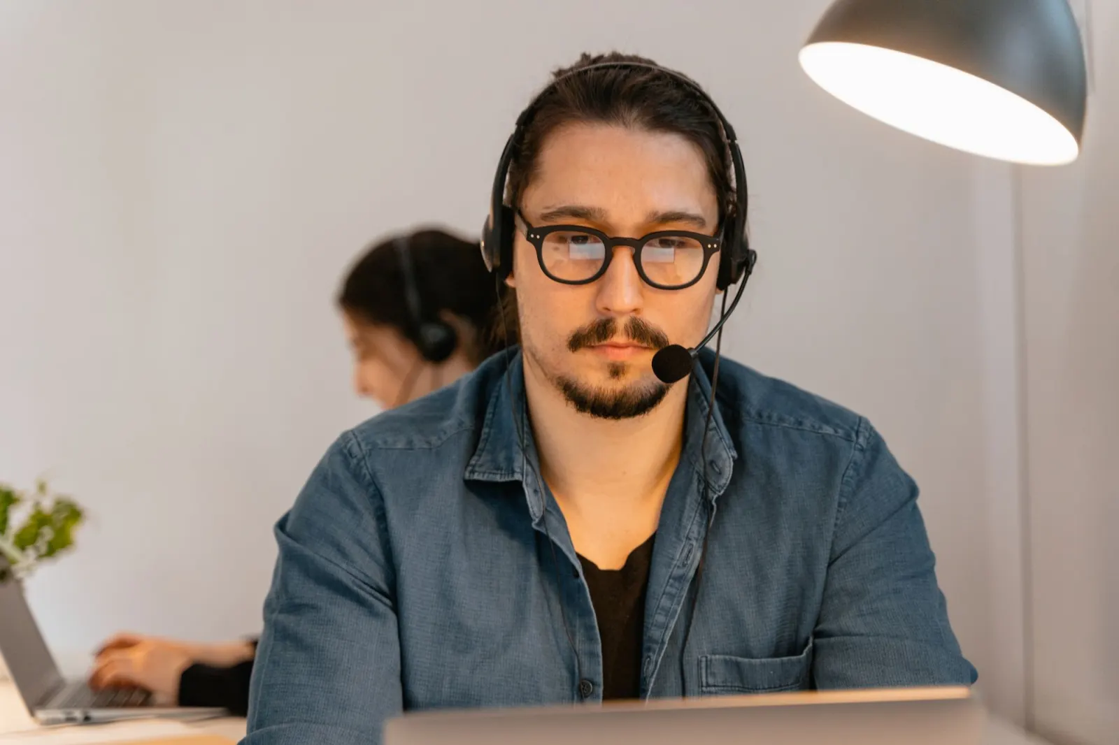 Agent wearing a headset while working