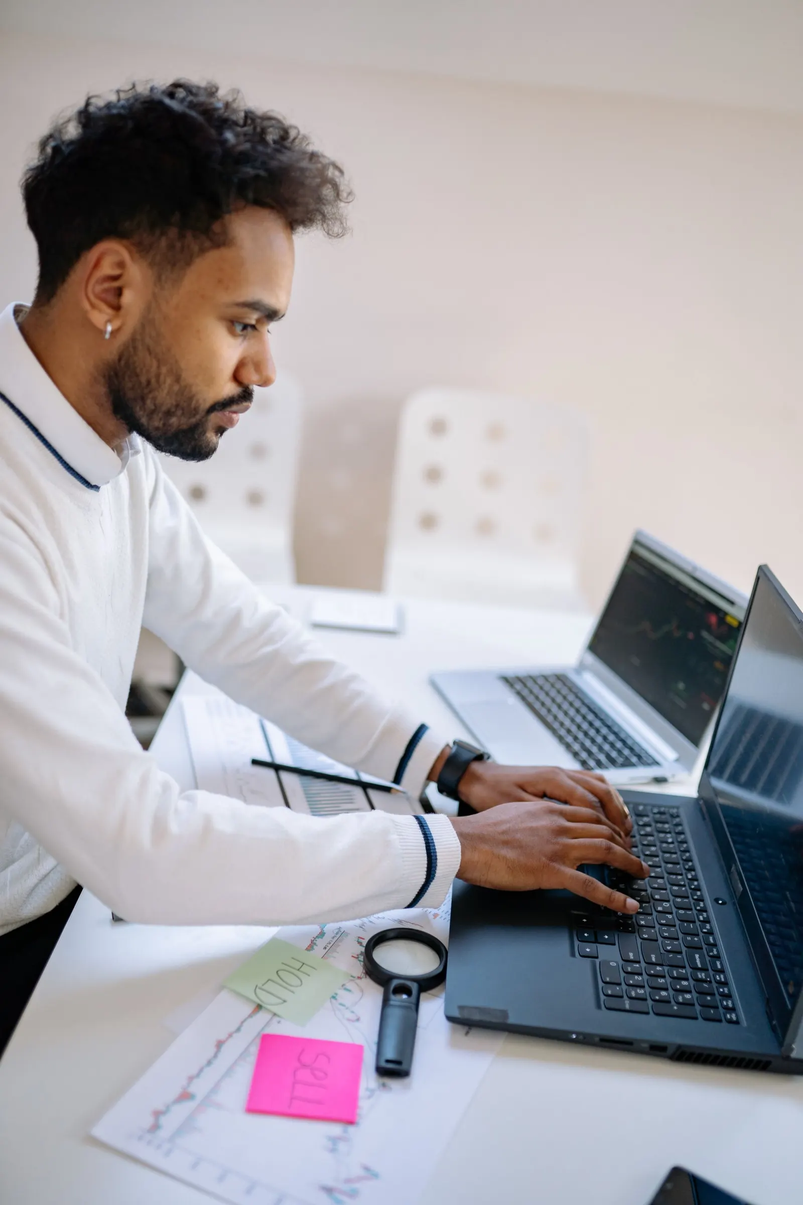 Person using a laptop at an office desk