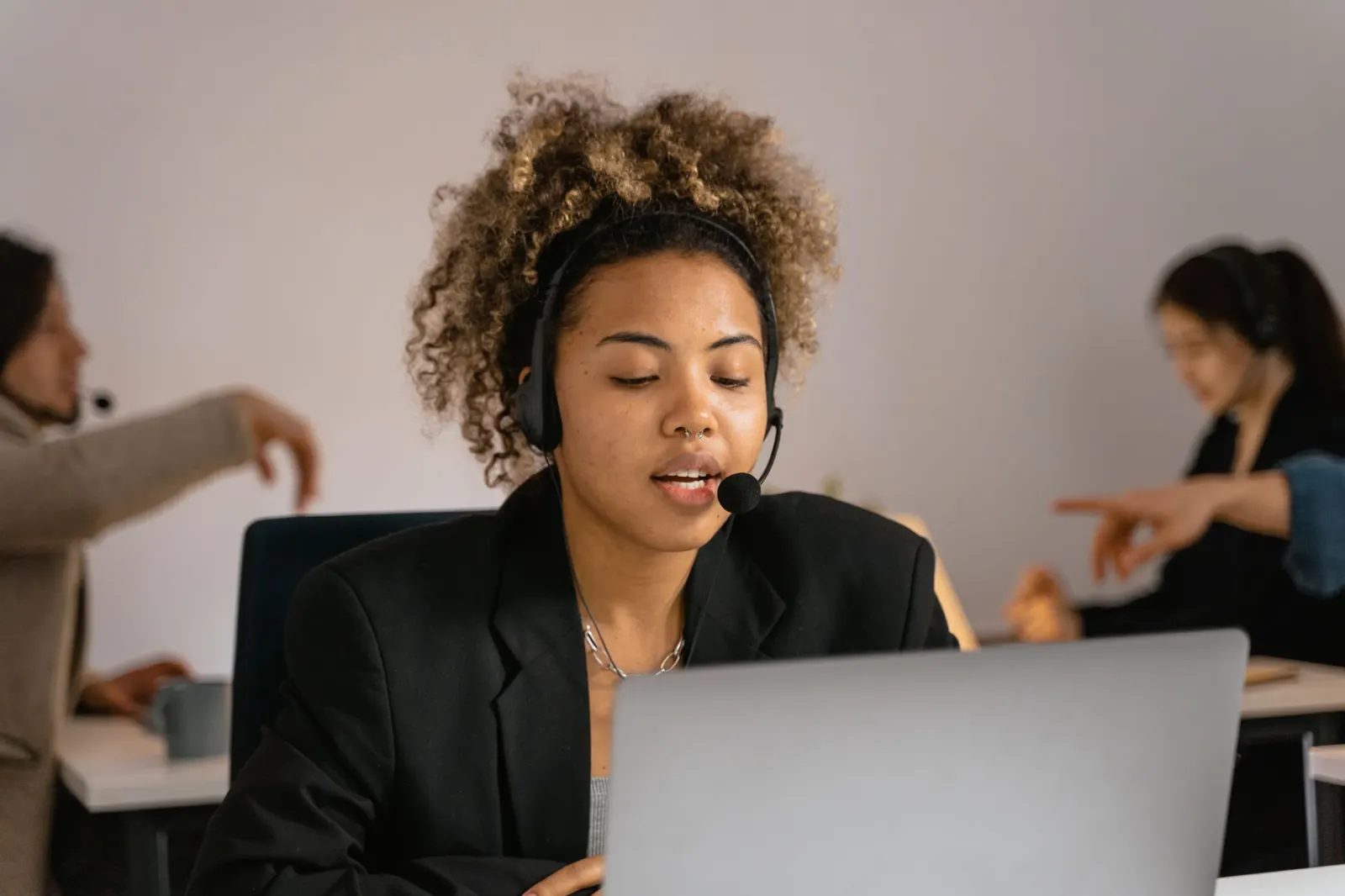 Call centre agent on a headset at her desk