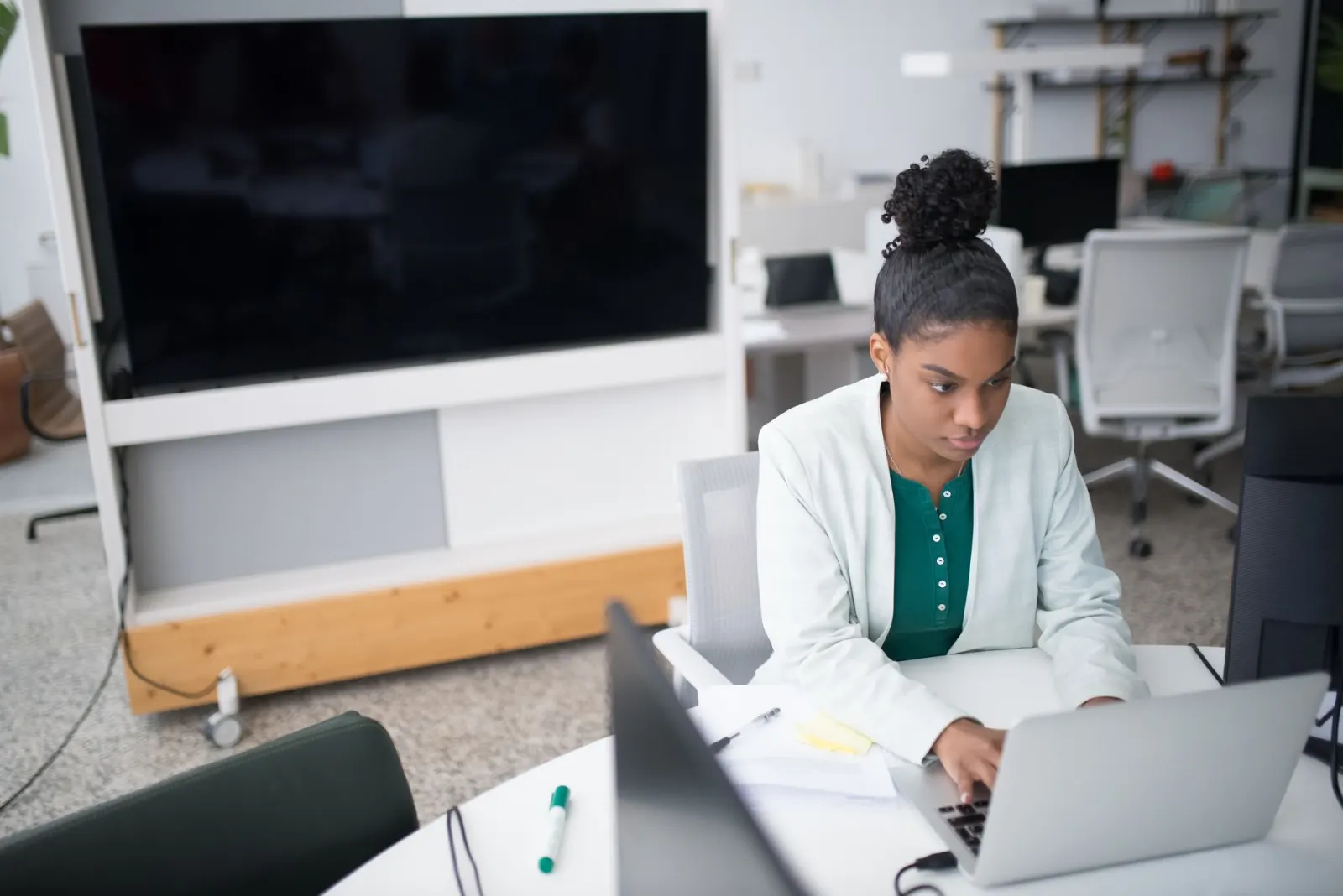 Person at a desk using a laptop